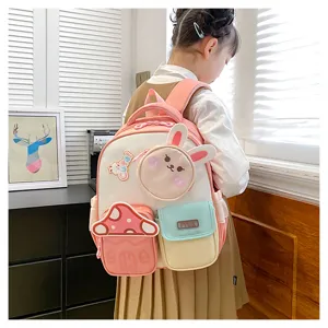 Joli mini sac à dos lapin rose pour filles de maternelle, cartable léger et mignon avec poches.