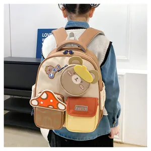 Joli mini sac à dos pour enfants ours de dessin animé, cartable léger pour tout-petits.