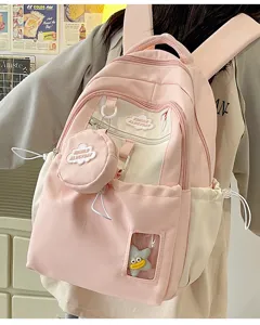 Rosa süßer Canvas Rucksack für Mädchen, kleiner Freizeitrucksack mit Münztasche und Anhänger.