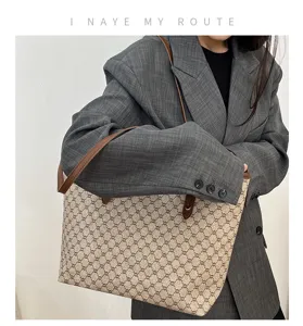 Stylish women's large capacity tote bag, vintage monogram shoulder bag for daily commuting.