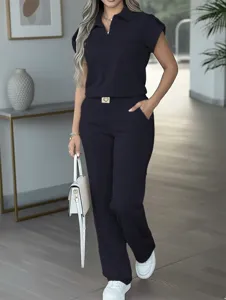 Women casual set featuring solid short sleeve polo top and straight drape trousers.