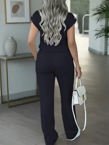 Detail view of the elegant navy casual two-piece suit with short sleeves and straight pants.