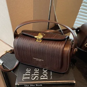 Niche design pillow handbag for women, stylish leather crossbody bag with metal lock.