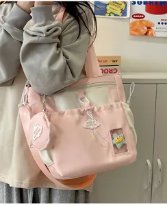 Süße rosa Segeltuch Umhängetasche für Damen, stilvoller Ins-Stil multifunktionaler Freizeitrucksack.