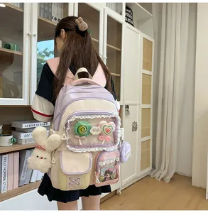 Süßer College-Stil Mehrfächer Color-Block Rucksack mit niedlichen Plüsch Lutscher Anhängern.