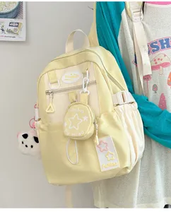 Zaino scolastico giallo in tela dallo stile giapponese carino con motivi a stelle e mini tasca.