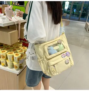 Süße einfarbige Umhängetasche Ita Bag mit transparenter Tasche für Kinder und Schüler.