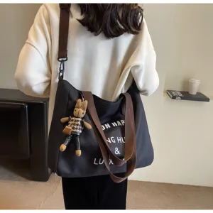 Große Canvas Schultertasche für Studenten, lässige Umhängetasche mit süßem Hasen Anhänger.