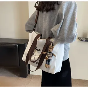 Detailansicht der lässigen Canvas Schultertasche, große Kapazität für Studenten Handtasche.