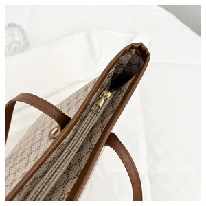 Women large capacity tote bag shoulder bag retro monogram canvas brown leather trim detail.