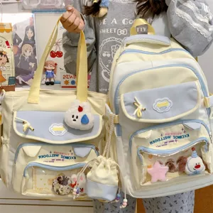 Farbblockierenden Studenten Rucksack Set mit transparentem Fenster und süßen Plüsch Anhängern.