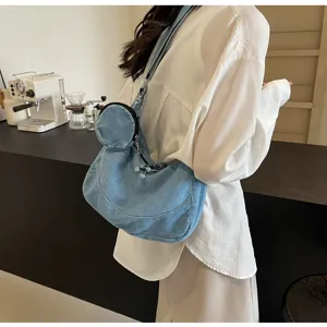 Korean style denim dumpling crossbody bag for women, lightweight soft shoulder bag detail view.