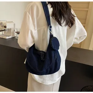 Casual denim hobo shoulder bag with small pouch detail, stylish daily crossbody bag.