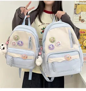Süßer zweifarbiger Canvas Schulrucksack mit niedlichen Ansteckern und Plüschanhänger für Frauen
