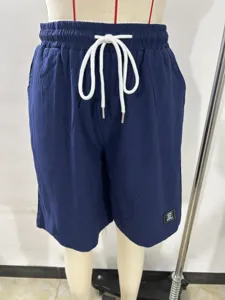 Men's cotton linen casual drawstring shorts solid color loose fit beachwear detail view