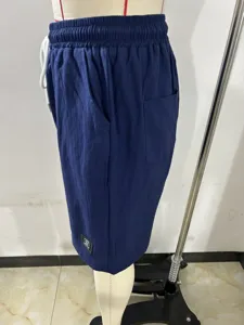 Men's casual cotton linen shorts with drawstring elastic waist and side pockets in dark blue color.