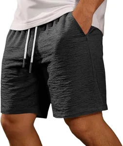 Men's casual summer shorts detail view featuring textured grey fabric and white drawstrings.