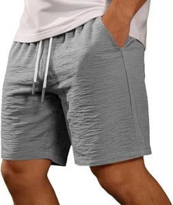 Detailed view of men's casual grey shorts, featuring elastic drawstring waist and deep pockets.
