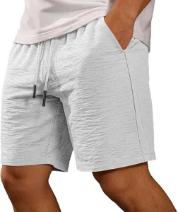 Close-up detail of men's casual shorts with drawstring waistband, textured fabric and pocket.