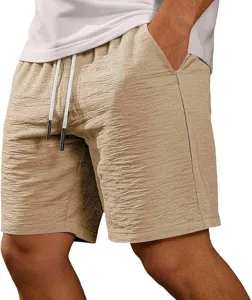 Close-up detail of men's casual khaki textured shorts with elastic drawstring waistband.