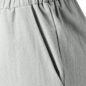 Close-up detail of women's casual linen blend trousers pocket and elastic waistband.