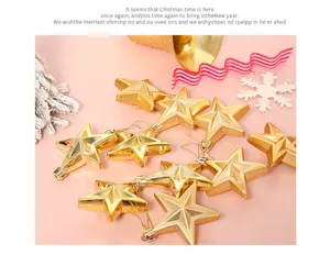 Detailed shot of glittering gold pentagram Christmas ornaments displayed for holiday decor.