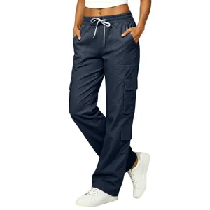 Detail view of women's dark blue cargo pants with multi pockets and white drawstring waist.