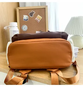 Detailed view of the casual canvas backpack showing bottom structure and straps.
