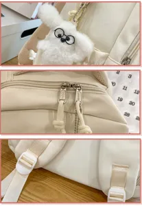 Koreanischer einfarbiger Segeltuch Rucksack Detail mit süßem Plüsch Hasenanhänger und Zubehör