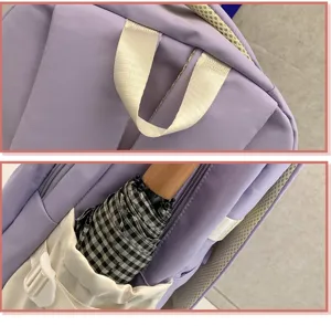 Lila weißer Schüler Rucksack Detailansicht mit oberem Griff und seitlicher Taschengestaltung.