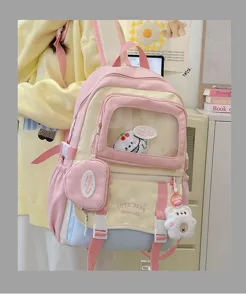 Suesse pastellfarbene Ita-Rucksacktasche mit transparenter Fronttasche und Plueschbaer-Anhaenger.