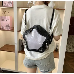 Star shaped ita bag detail view, black leather backpack with clear display window for pins.
