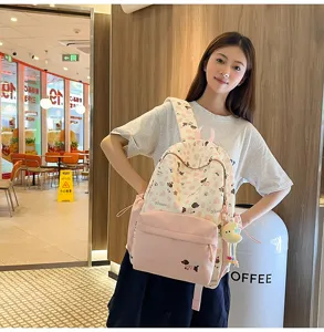 Niedlicher japanischer pinker Hundedruck Canvas Rucksack für Mädchen im Schulalltag.