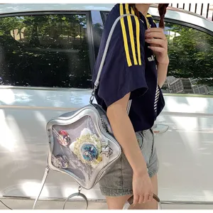 Detailed view of silver star ita bag with transparent mesh window and anime badges inside.