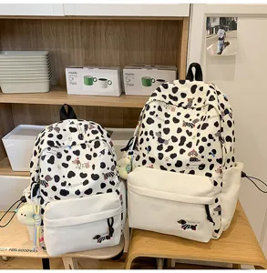 Süßer Kuhmuster Schulrucksack für Studenten, stilvolle tägliche Freizeittasche mit niedlichem Hund.
