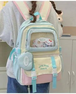 Süßer farbblockierter Schulrucksack mit transparenter Vordertasche im süßen Detail.