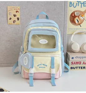 Süßer farbiger Rucksack mit transparentem Sichtfenster, Fronttasche und passender kleiner Tasche.