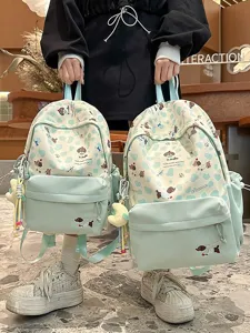Süßer mintgrüner Canvas Rucksack für Schülerinnen mit süßem Cartoon Hundeprint Design.