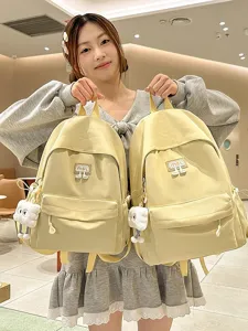 Niedlicher gelber Damen Canvas Rucksack grosser Kapazitaet Schultertasche mit Anhaenger