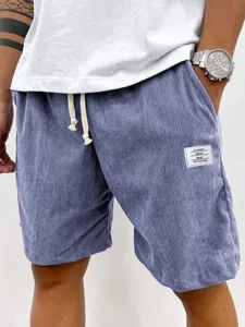 Men's casual corduroy drawstring shorts with pockets and classic white brand label detail.
