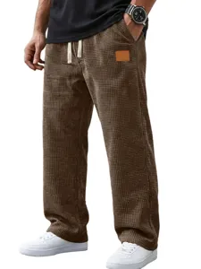 Mens brown waffle knit straight leg casual pants with drawstring and pocket patch.
