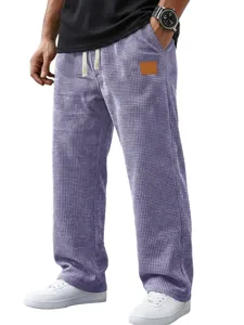 Men's stylish waffle knit casual straight long pants with pockets and drawstring.