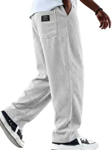 Close-up detail of casual straight-leg corduroy trousers in light grey color, relaxed fit.