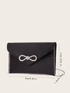 Schwarze Abendtasche aus Satin mit Strass-Schleife und Kettengürtel, elegantes Design.