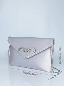 Silberne Satin Abendtasche mit Strass Schleife und Kette fur elegante Damen Party Details.