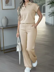 Stylish women casual solid color two-piece outfit short sleeve polo top and wide leg pants set.