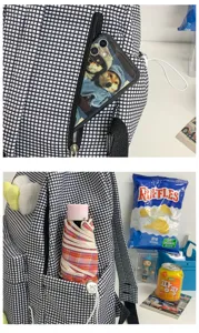 Schwarz-weisses Karomuster Schulrucksack Detailansicht mit Fronttasche fuer praktische Nutzung.