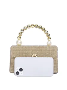 Goldene Strass Abendtasche Detail, glitzernde Kristalle und Luxus Perlen Griff Design.