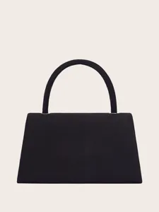 Nahansicht der schwarzen Samt Handtasche mit strukturierter Trapezform und Tragegriff.
