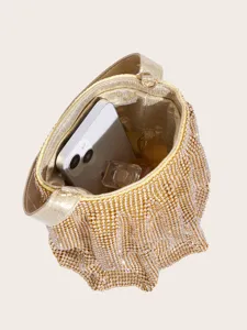 Atemberaubende goldene Strass-Eimerhandtasche Detail zeigt Innenfach und glänzendes Design.
